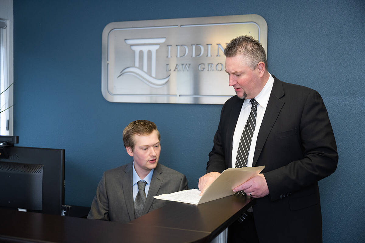 Rob Iddins (right), managing partner of Iddins Law Group in Kent. Call 253-854-1244 or visit iddinslaw.com/contact-us to request a complimentary 15 minute phone consultation. Charles Cotugno photo.